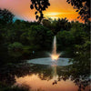 Image of Scott 1HP Pond Fountain Skyward Pattern by Scott Aerator Operating in a Pond with Trees at the Back During Dusk with Lights 13008