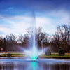 Image of Scott 3HP Fountain with Skyward Pattern Operating in a Pond with Trees at the Back 13230