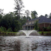 Image of Kasco 1/2HP Aerating Fountain 2400VFX  Operating in a Pond in Front of a House Surrounded by Trees
