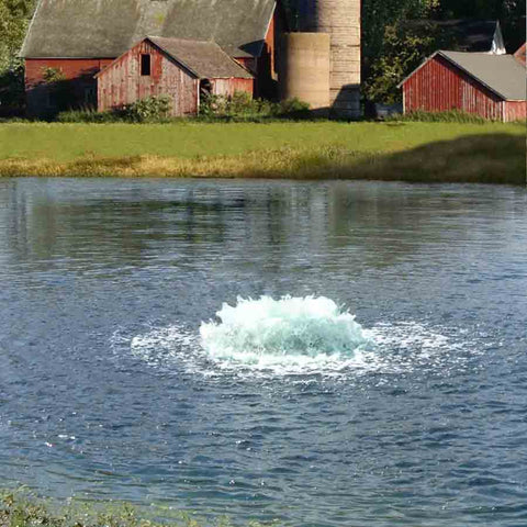 Kasco 3-Phase 3HP Surface Aerator 3.3AF 230V Operating in a Pond with Red Sheds at the Back