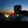 Image of Kasco Aerating Fountains Operating in a Pond at night with Different Lights at Night