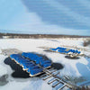 Image of Kasco De-Icer Operating in Icy water in a Dock with Boats Under Blue Covers