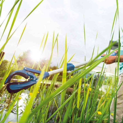 Oase Long Reach Easy Pick Pond Grabber for Pond Cleaning and Maintenance 42764 Being Used to Collect Pond Debris