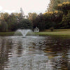 Image of Scott 1HP Display Aerator Operating in a Pond with a Gazebo and Trees at the Back 14025