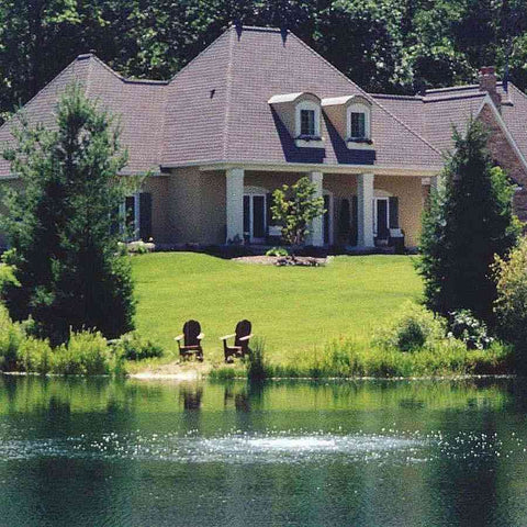 Scott Bubble Pro Operating Under Water in a Pond with a House at the Back 44010