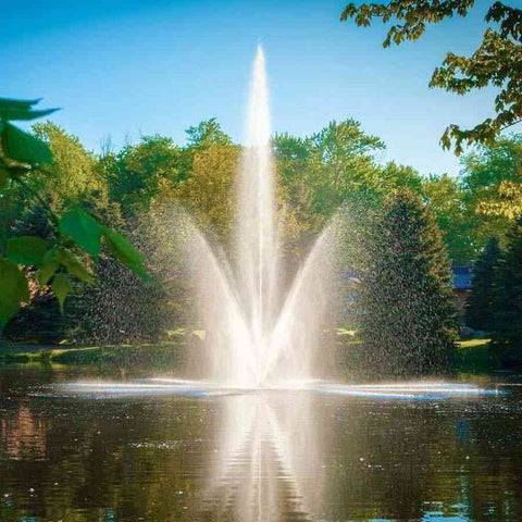 Scott 1-1/2HP Pond Fountain with Atriarch Pattern Operating in a Pond with Trees at the Back 13015