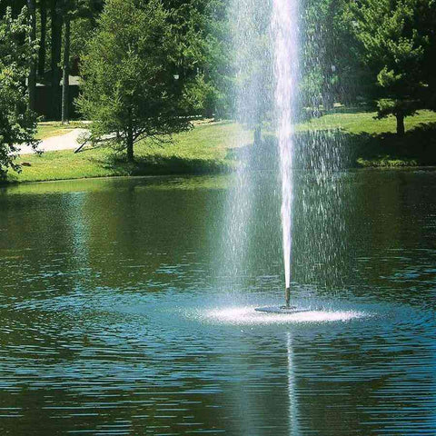 Scott 1-1/2HP Pond Fountain Gusher Pattern by Scott Aerator Operating in a Pond with Trees at the Back 13517