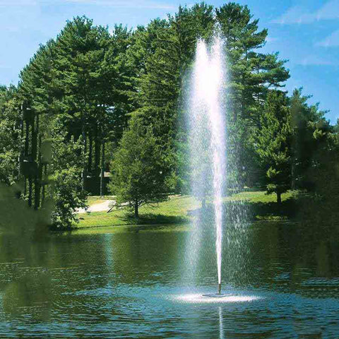 Scott 1-1/2HP Pond Fountain Gusher Pattern by Scott Aerator Operating in a Pond with Trees at the Back 13517