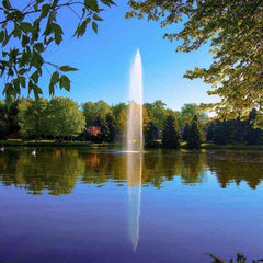 Scott 1-1/2HP Pond Fountain Gusher Pattern by Scott Aerator Operating in a Pond with Trees at the Back 13517