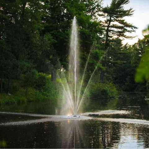 Scott 1HP Pond Fountain Clover Pattern by Scott Aerator Operating in a Pond with Trees at the Back 13000