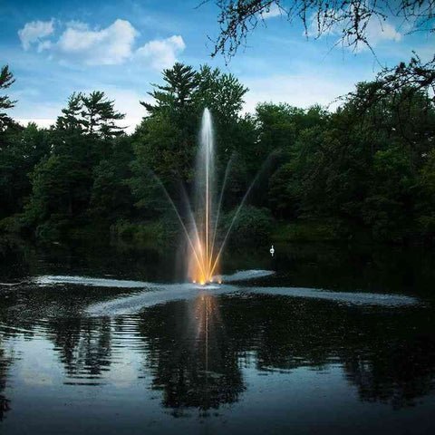 Scott 1HP Pond Fountain Clover Pattern by Scott Aerator Operating at Night in a Pond with Orange Lights 13000