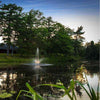Image of Scott 1HP Pond Fountain Skyward Pattern by Scott Aerator Operating in a Pond with Trees at the Back 13008