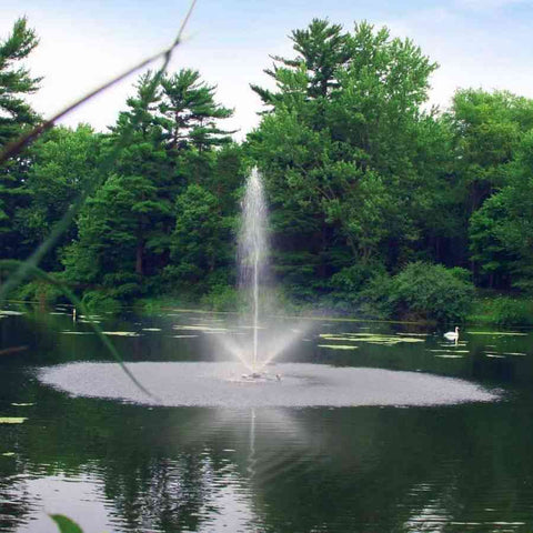 Scott 1/2HP Pond Fountain Skyward Pattern by Scott Aerator Operating in a Pond with Trees at the Back 13005