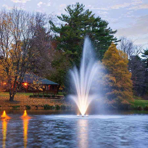 Scott 3HP Fountain with Amerst Pattern Operating in a Pond in Dusk time with Lights 13240
