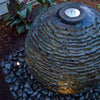 Image of Aquascape Medium Stacked Slate Sphere Operating Beside a Gazebo Shown Up Close Top View 78288