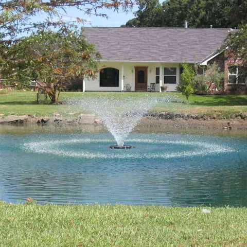 Kasco 2HP Aerating Fountain 8400VFX 2.3VFX with V-Shape Pattern Nozzle Operating in a Pond with Trees