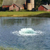 Image of Kasco 3-Phase 3HP Surface Aerator 3.3AF 230V Operating in a Pond with Red Sheds at the Back