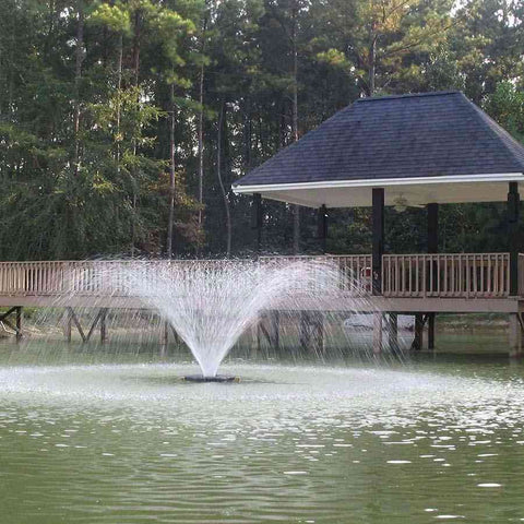 Kasco 3/4HP Aerating Fountain 3400VFX with V-Shape Pattern Operating in a Pond in Front of a Deck