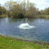 Image of Kasco 3/4HP Surface Aerator 3400AF Operating in a Pond with Trees at  the Back 115V/230V