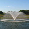 Image of Kasco 5HP Aerating Fountain 5.1VFX with V-Shape Pattern Operating in a Pond with Trees at the Back