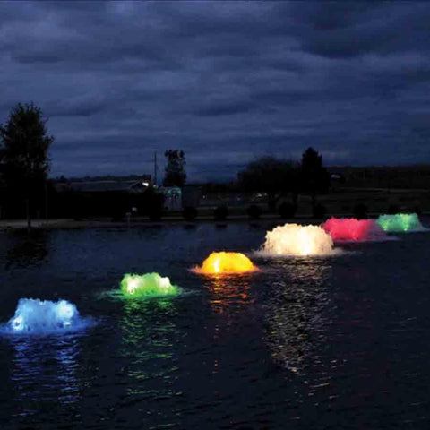 Group of Kasco Surface Aerators Operating in a Pond at Night with Different Colored Lights