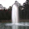 Image of Kasco 5HP Decorative Fountain 5.1JF 5.3JF 230V with Spruce Pattern Operating in a Pond with Trees at the Back