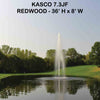 Image of Kasco 3-Phase 7HP Decorative Fountain 7.3JF 230V with Redwood Pattern Operating in a Pond with Trees at the Back
