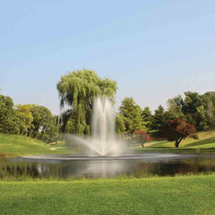 Kasco 3-Phase 7HP Decorative Fountain 7.3JF 230V with Linden Pattern Operating in a Pond with Trees at the Back