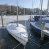 Image of Kasco De-Icer Operating in Icy water in a Dock with Boats