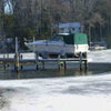 Image of Kasco De-Icer Attached to a Dock with Icy Water.