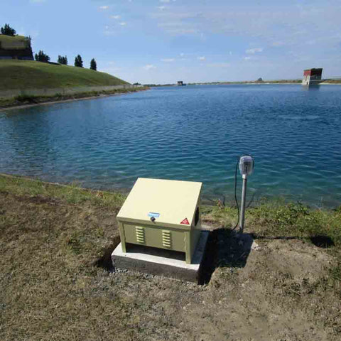 Kasco Robust Aire Sub Surface Aeration System RA1 Operating in a Pond with a Ground Cabinet nearby
