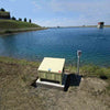 Image of Kasco Robust Aire Sub Surface Aeration System RA1 Operating in a Pond with a Ground Cabinet nearby
