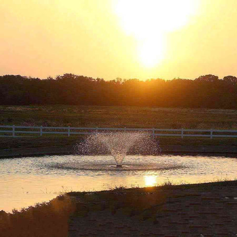 Scott 2HP Display Aerator Operating in a Pond with the Sun setting 14028