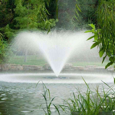 Scott 1.5HP North Star Fountain Displat Aerator Operating in a Pond with Trees at the Back 14026