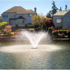 Image of Scott 1.5HP North Star Fountain Displat Aerator Operating in a Pond with Houses at the Back 14026
